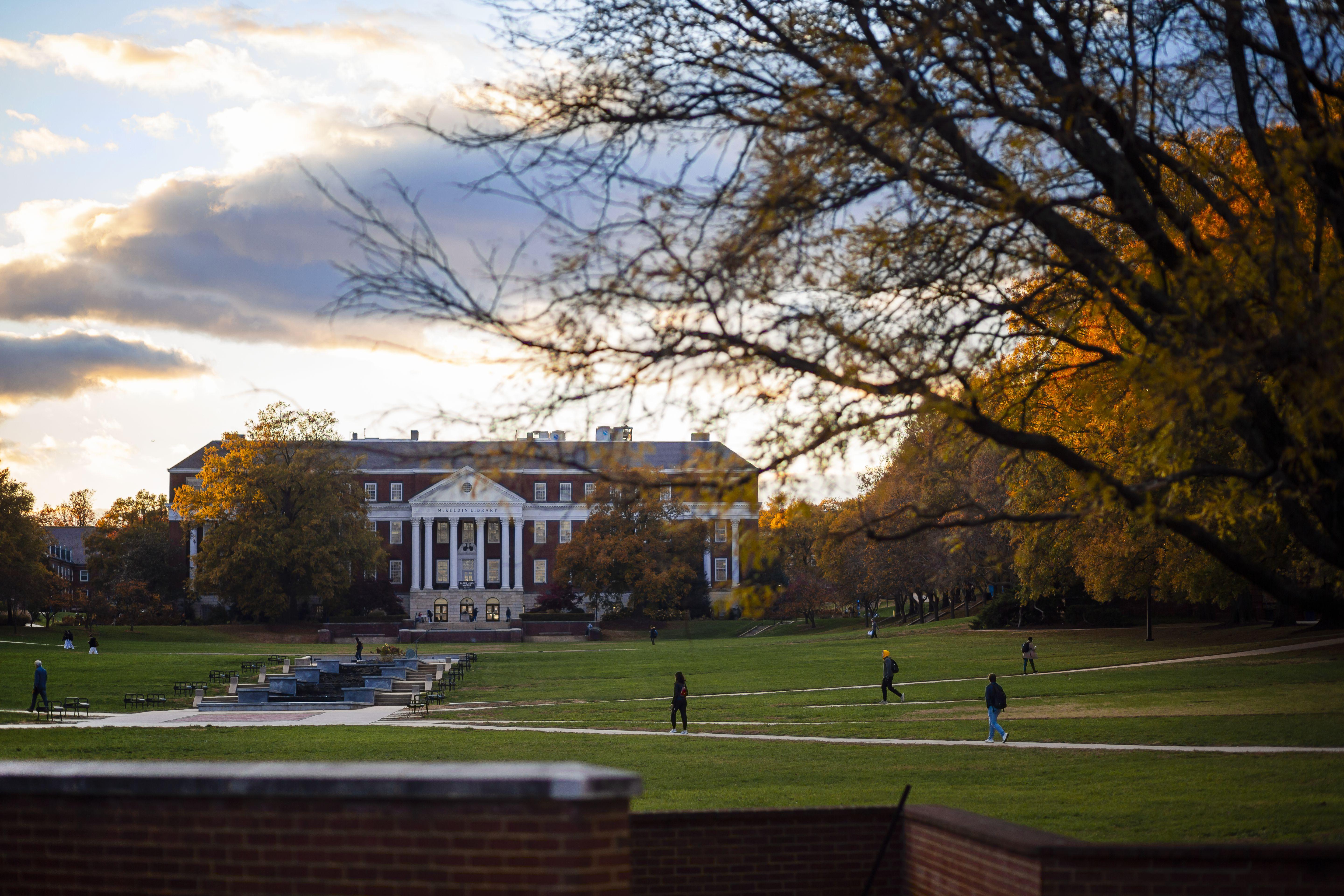 Students walk across the mall in front of McKeldin library. 