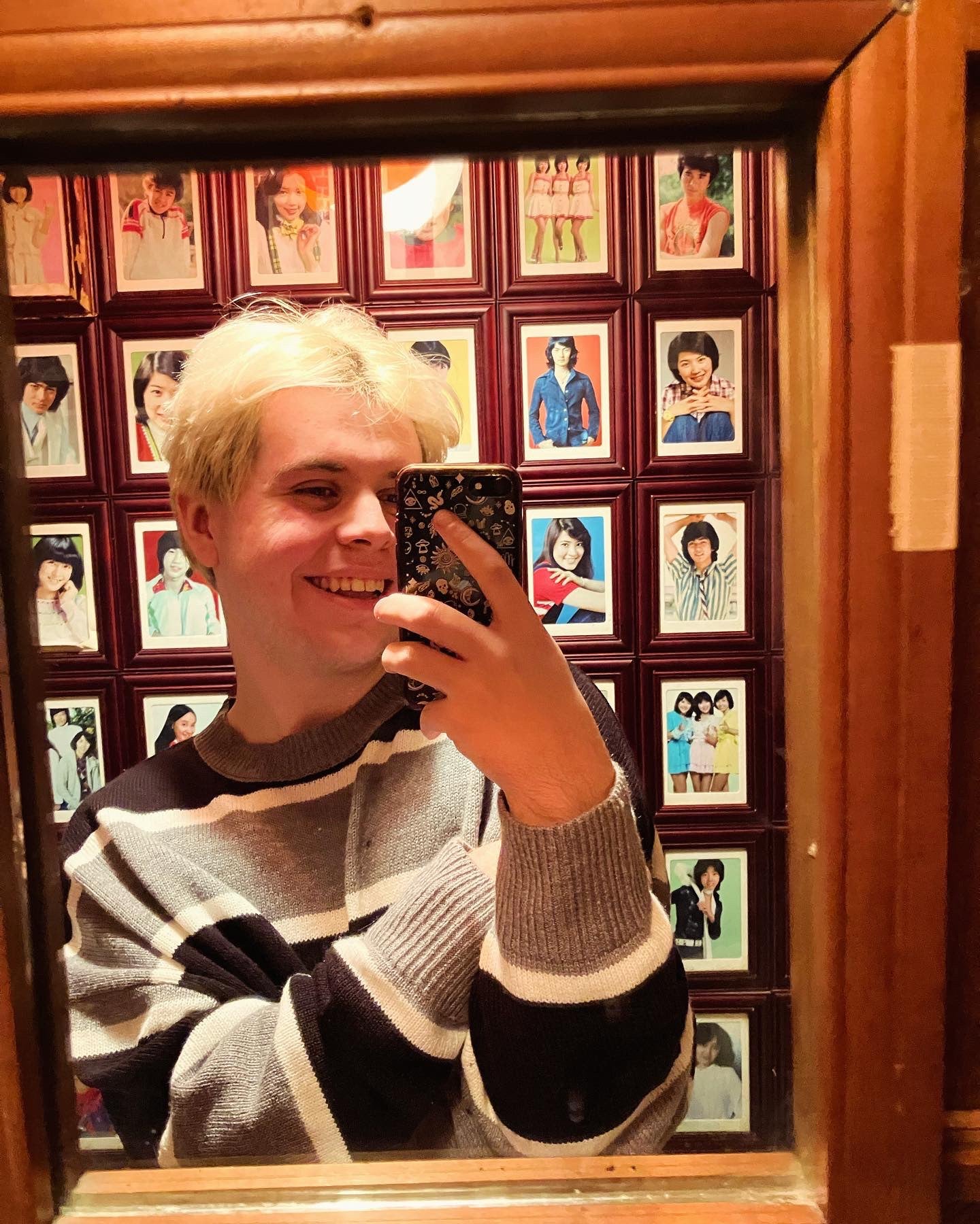 Jack takes a photo in a mirror