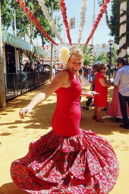 Anna dances in the a flamenco dress during Sevilla's annual festival.
